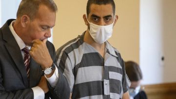 FILE - Defense attorney Nathaniel Barone, left, and Hadi Matar, 24, right, listen during an arraignment in the Chautauqua County Courthouse in Mayville, NY., Thursday, Aug. 18, 2022. Matar, who severely injured author Salman Rushdie in a frenzied knife attack in western New York faces a new charge that he supported a terrorist group. An indictment unsealed in U.S. District Court in Buffalo on Wednesday, July 24, 2024, charges Matar with providing material support to Hezbollah, a militant group based in Lebanon and backed by Iran. (AP Photo/Joshua Bessex, File)