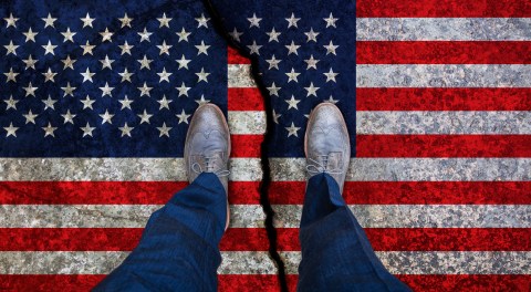 Business,Man,Stands,On,Cracked,Flag,Of,Usa.,Political,Concept