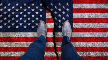 Business,Man,Stands,On,Cracked,Flag,Of,Usa.,Political,Concept