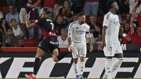 Vedat Muriqi celebra su gol ante Dani Carvajal y Vinicius Junior.