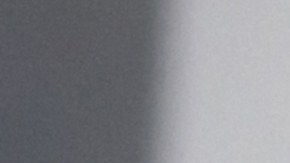 Happy Latin American couple shopping online from home using their tablet and paying by card