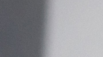 Happy Latin American couple shopping online from home using their tablet and paying by card