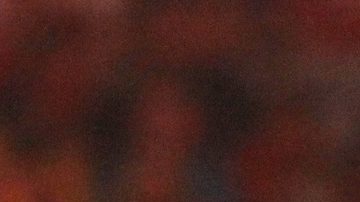 La superestrella de la WWE John Cena, a la izquierda, ataca a Batista con el hombro en WrestleMania XXVI