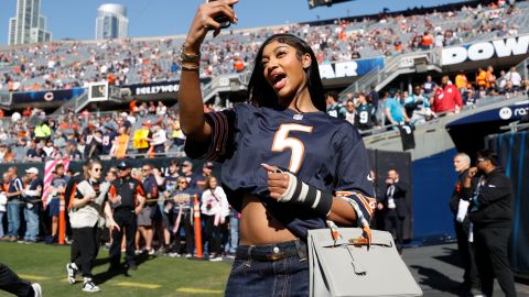 Chicago Sky WNBA basketball player Angel Reese stands on the sidelines prior to an NFL football game between the Chicago Bears and Carolina Panthers, Sunday, Oct. 6, 2024, in Chicago. (AP Photo/Kamil Krzaczynski)