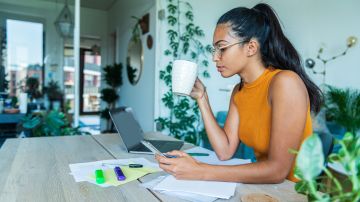 Young women working at home stock