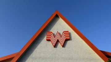 FILE - This Thursday, July 9, 2015, file photo shows a Whataburger restaurant in San Antonio, Texas. The Texas restaurant chain said on social media Wednesday, June 28, 2017, that a story shared online that claims it would be going out of business on Aug. 1 is a hoax. (AP Photo/Eric Gay, File)