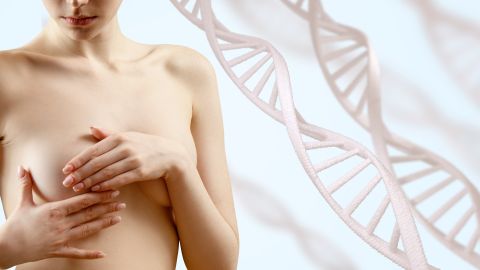 Young,Woman,Checks,Breasts,For,Neoplasms,Among,Dna,Chains.,Over