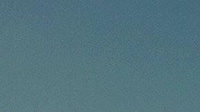 Young,Woman,Sitting,In,A,Glass,Jar,On,A,Beach