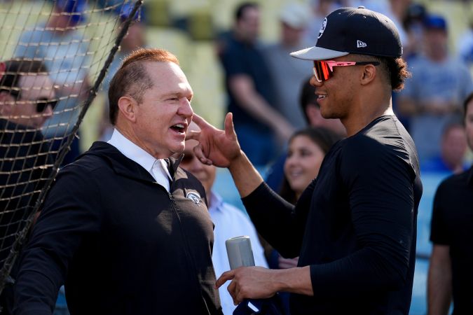 Scott Boras junto a Juan Soto.