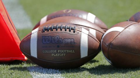 Footballs sit on the turf ready for kick-off before the start of an NCAA football game between South Carolina and North Carolina State in Charlotte, N.C., Saturday, Sept. 2, 2017. South Carolina won 35-28. (AP Photo/Bob Leverone)