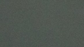 Happy Latin American couple at home paying bills online on their laptop and smiling - financial technology concepts