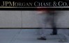 FILE - The JPMorgan Chase & Co. logo is displayed at their headquarters in New York, in this Monday, Oct. 21, 2013, file photo. A person close to the talks says the Justice Department and JPMorgan Chase & Co. have reached agreement on all issues in a $13 billion settlement of a civil inquiry into the company's sales of low-quality mortgage-backed securities that collapsed in value in the financial crisis. (AP Photo/Seth Wenig, File)