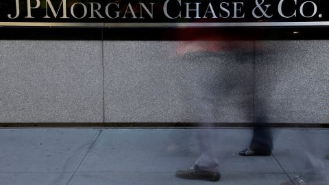 FILE - The JPMorgan Chase & Co. logo is displayed at their headquarters in New York, in this Monday, Oct. 21, 2013, file photo. A person close to the talks says the Justice Department and JPMorgan Chase & Co. have reached agreement on all issues in a $13 billion settlement of a civil inquiry into the company's sales of low-quality mortgage-backed securities that collapsed in value in the financial crisis. (AP Photo/Seth Wenig, File)