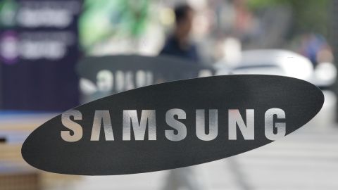 A man walks past near the logos of the Samsung Electronics at its show room in Seoul, South Korea, Wednesday, July 7, 2010. Samsung Electronics Co., said it expects consolidated operating profit of between 4.8 trillion won and 5.2 trillion won ($4.2 billion) for the three months ended June 30, according to a statement. That would beat the company's previous all-time high of 4.41 trillion won set in the first quarter. (AP Photo/ Lee Jin-man)