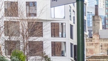 A B41 bus drops off passengers at a newly installed bus boarding island on Livingston Street.