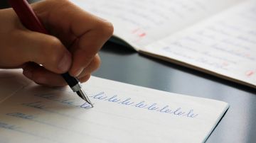 Detail,Of,A,Child's,Left,Hand,Writing,The,Syllables,Li