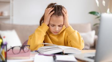 Exhausted,Schooler,Girl,Suffering,From,Doing,Homework,,Tired,From,Studying
