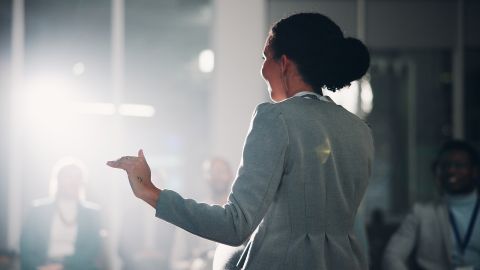 Woman,,Speaker,And,Audience,At,Convention,,Stage,Or,Discussion,With