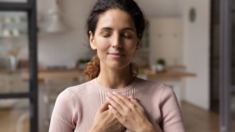 Close,Up,Of,Calm,Young,Caucasian,Woman,Hold,Hands,On
