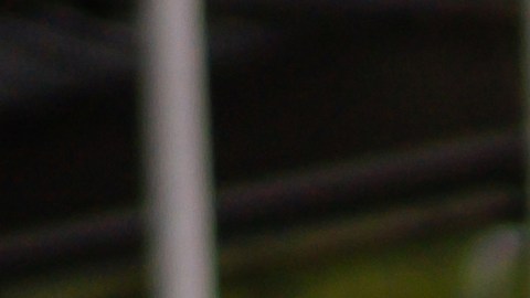 Salesman greeting with a handshake a happy Latin American family interested in buying a car at the dealership - car ownership concepts