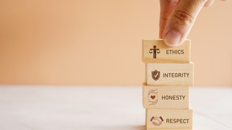 Hand,Holding,Wooden,Block,With,Code,Of,Conduct,Concept,,Ethics,