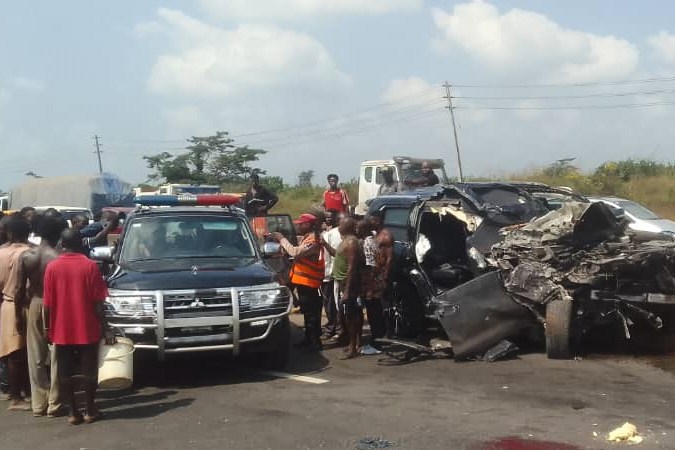 In this photo provided by the Federal Road Safety Corps, people gather at the accident scene of British boxer Anthony Joshua in Lagos, Nigeria, on Monday, Dec. 29, 2025. (Federal Road Safety Corps via AP)