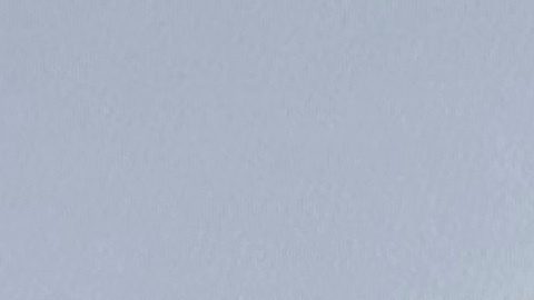 FILE - An image of former Canadian Olympic snowboarder Ryan Wedding, who is a fugitive and been charged with allegedly running and participating in a transnational drug trafficking operation, is displayed on a video monitor along with bricks of cocaine, foreground, during a news conference at the FBI offices in Los Angeles, Oct. 17, 2024. (AP Photo/Damian Dovarganes, File)