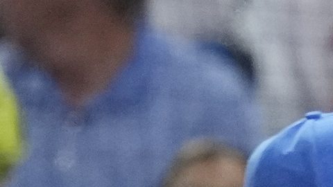 Cuba's Roel Santos (1) is congratulated by his teammates after he scored in the first inning at a World Baseball Classic game against the U.S., Sunday, March 19, 2023, in Miami. (AP Photo/Marta Lavandier)