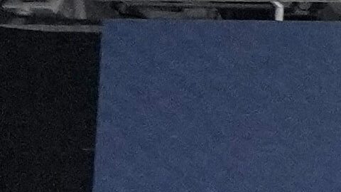 Workers prepare the field at the Santiago Bernabeu stadium ahead of an NFL game between the Miami Dolphins and Washington Commanders in Madrid, Spain, Friday, Nov. 14, 2025. (AP Photo/Steve Luciano)