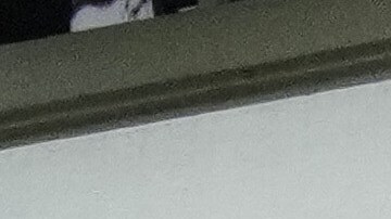 Journalists gather outside the Argentine Soccer Association (AFA) headquarters being raided as part of a judicial investigation into links authorities allege AFA has with a financial services company being investigated for alleged money laundering in Buenos Aires, Argentina, Tuesday, Dec. 9, 2025. (AP Photo/Rodrigo Abd)