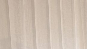 In this photo supplied by Australia's Minister for Home Affairs Tony Burke's office, the Minister Tony Burke, center, poses in an undisclosed location with five Iranian women soccer players who have been granted asylum in Australia, Tuesday, March 10, 2026. (Australia Ministry of Home Affairs via AP)