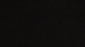 Se ven carteles con una foto de Charlie Kirk antes de que el vicepresidente JD Vance hable en un evento de Turning Point USA.